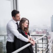 depositphotos_176447994-stock-photo-young-couple-love-standing-balcony